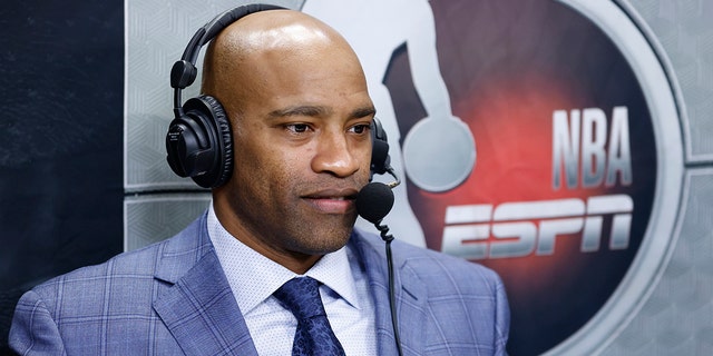 ESPN commentator Vince Carter looks on prior to a preseason game between the Miami Heat and the Boston Celtics at FTX Arena on October 15, 2021 in Miami, Florida.