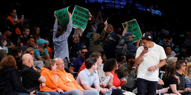Demonstrators display signs during a New York Liberty and Minnesota Lynx game at Barclays Center on June 7, 2022 in Brooklyn.