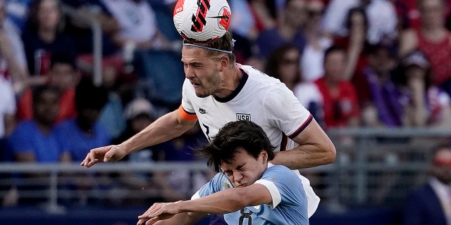 Uruguay forward Facundo Pellistri and USA defender Walker Zimmerman battle for the ball Sunday, June 5, 2022, in Kansas City, Kansas.