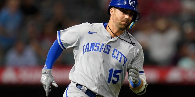 Kansas City Royals' Whit Merrifield (15) doubles during the eleventh inning of a baseball game against the Los Angeles Angels in Anaheim, Calif., Tuesday, June 21, 2022. Nicky Lopez scored. 