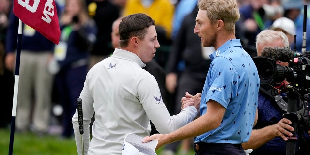 Matthew Fitzpatrick, left, of England, and Will Zalatoris meet after Fitzpatrick won the U.S. Open golf tournament at The Country Club, Sunday, June 19, 2022, in Brookline, Mass.