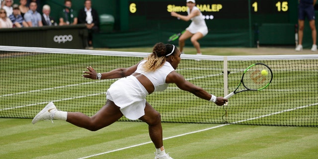 FILE - Serena Williams returns the ball to Romania's Simona Halep, background, during the women's singles final match on day twelve of the Wimbledon Tennis Championships in London, Saturday, July 13, 2019.