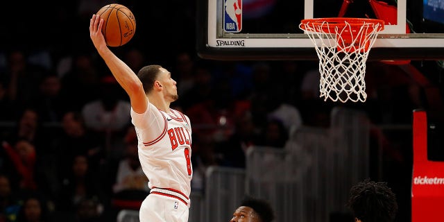 Zach LaVine #8 of the Chicago Bulls dunks against Bruno Fernando #24 of the Atlanta Hawks in the first half at State Farm Arena on November 06, 2019 in Atlanta, Georgia.