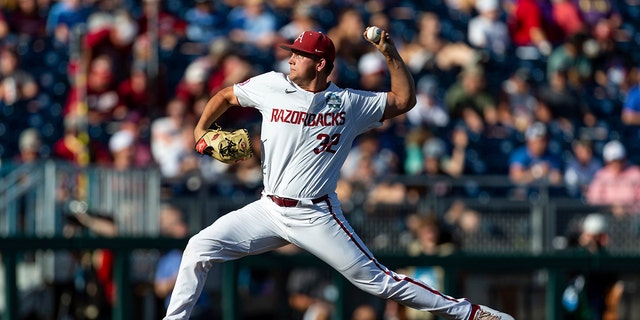 Arkansas starting pitcher Zack Morris (32) throws a pitch against Mississippi in the first inning during an NCAA College World Series baseball game, Monday, June 20, 2022, in Omaha, Neb. 