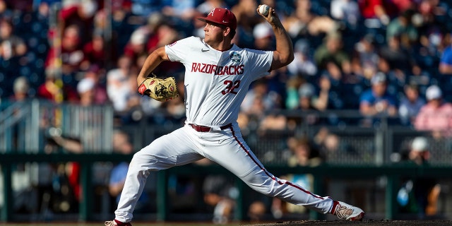 Arkansas starting pitcher Zack Morris (32) throws a pitch against Mississippi in the first inning during an NCAA College World Series baseball game, Monday, June 20, 2022, in Omaha, Neb. 