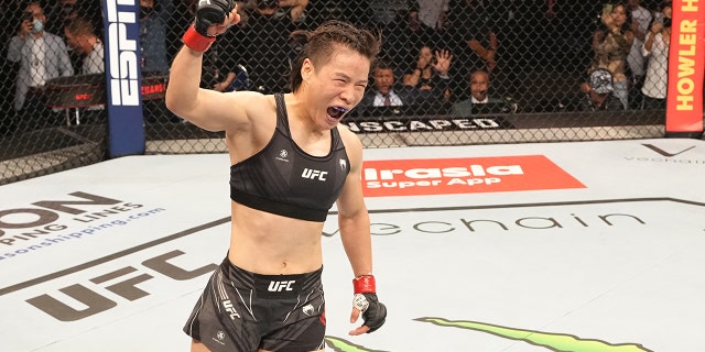 Zhang Weili of China celebrates after her knockout victory over Joanna Jedrzejczyk of Poland in a flyweight fight during the UFC 275 event at Singapore Indoor Stadium June 12, 2022, in Singapore.