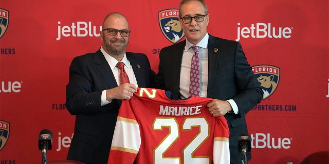 Paul Maurice, right, is introduced as the new head coach of the Florida Panthers by general manager Bill Zito, during an NHL hockey news conference at FLA Live Arena, Friday, June 23, 2022, in Sunrise, Fla.