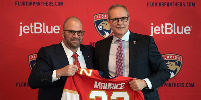 Paul Maurice, right, is introduced as the new head coach of the Florida Panthers by general manager Bill Zito, during an NHL hockey news conference at FLA Live Arena, Friday, June 23, 2022, in Sunrise, Fla. 