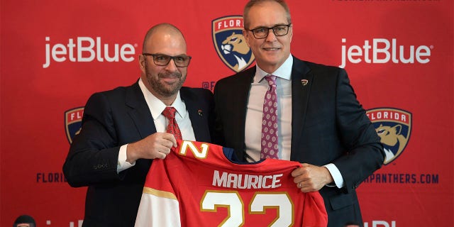 Paul Maurice, right, is introduced as the new head coach of the Florida Panthers by general manager Bill Zito, during an NHL hockey news conference at FLA Live Arena, Friday, June 23, 2022, in Sunrise, Fla.