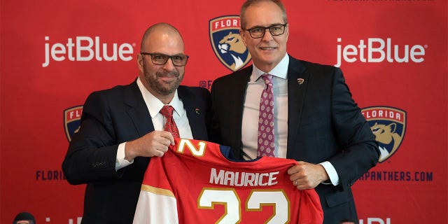 Paul Maurice, right, is introduced as the new head coach of the Florida Panthers by general manager Bill Zito, during an NHL hockey news conference at FLA Live Arena, Friday, June 23, 2022, in Sunrise, Fla. 