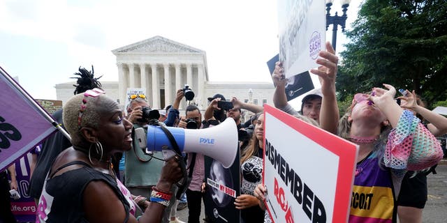 People protest about abortion, Friday, June 24, 2022, outside the Supreme Court in Washington. 