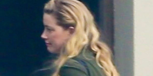 Amber Heard arrives for flight at Teterboro Airport in Bergen County, New Jersey.