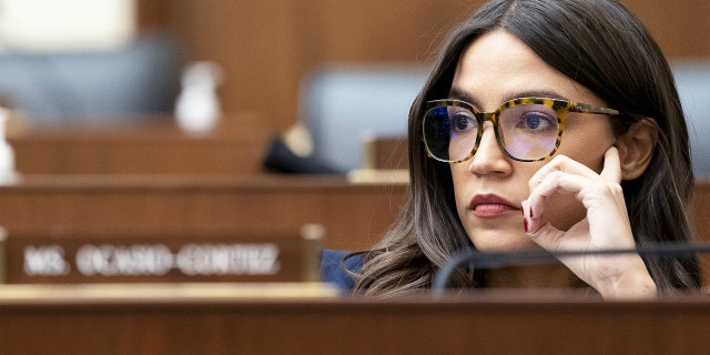 Representative Alexandria Ocasio-Cortez, a Democrat from New York, listens during a House Financial Services Committee hearing in Washington, D.C., U.S., on Wednesday, Dec. 8, 2021. Photographer: Stefani Reynolds/Bloomberg via Getty Images
