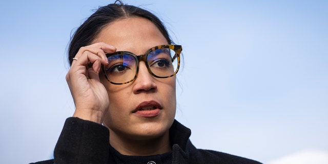 Rep. Alexandria Ocasio-Cortez (D-NY) prepares to speak during a rally for immigration provisions to be included in the Build Back Better Act outside the U.S. Capitol December 7, 2021, in Washington, DC.