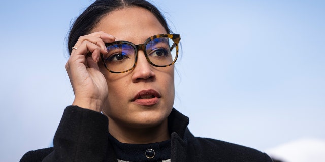 Rep. Alexandria Ocasio-Cortez (D-NY) prepares to speak during a rally for immigration provisions to be included in the Build Back Better Act outside the U.S. Capitol December 7, 2021 in Washington, DC. Progressive Democrats are urging the Senate to include a pathway to citizenship for undocumented immigrants living in the U.S. in the Build Back Better Act.