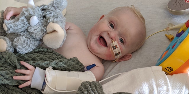 What a smile! Tennessee six-month-old August Stoll remains cheerful here despite his battle against a severe heart defect. (@FightForAugust)