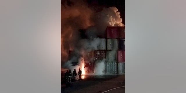 Firefighters try to contain a blaze that broke out in an inland container depot at Sitakunda, near the port city Chittagong, Bangladesh, June 4,2022, in this screen grab obtained from a video on social media.