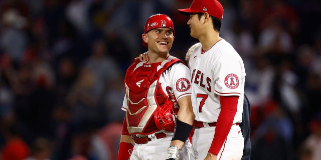 Shohei Ohtani and Max Stassi of the Los Angeles Angels celebrate a 5-2 win against the Boston Red Sox on June 9, 2022, in Anaheim, California.