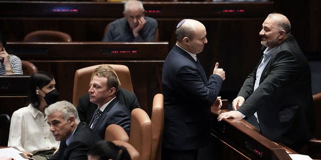 Israeli Prime Minister Naftali Bennett (center) will meet with Parliamentarian Mansour Abbas on Thursday, June 30, 2022 at Knesset, the Israeli parliament in Jerusalem, prior to voting on the parliamentary dissolution bill.