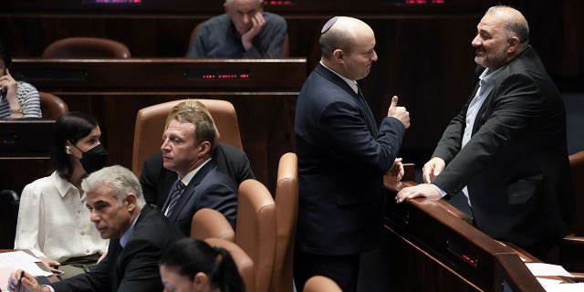 Israeli Prime Minister Naftali Bennett (center) will meet with Parliamentarian Mansour Abbas on Thursday, June 30, 2022 at Knesset, the Israeli parliament in Jerusalem, prior to voting on the parliamentary dissolution bill.