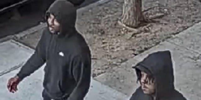 The two suspects walked along with the victim and spoke to him before the man on the left allegedly sucker punched the victim on May 25. 