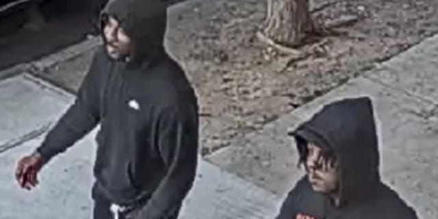 The two suspects walked along with the victim and spoke to him before the man on the left allegedly sucker punched the victim on May 25. 