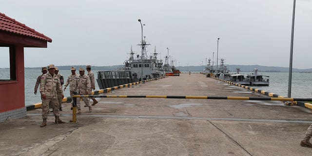 Cambodian navy troop members walk on the pier at Ream Naval Base in Sihanoukville, southwestern of Phnom Penh, Cambodia on July 26, 2019. Cambodian officials broke ground Wednesday, June 8, 2022, on a naval port expansion project in Ream, dismissing American concerns it could provide Beijing with a strategically important outpost on the Gulf of Thailand. (G3 Box News Photo/Heng Sinith, File)