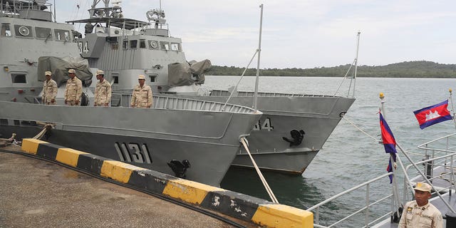 Cambodian naval crew stands on a patrol boat at Ream Naval Base in Sihanoukville, southwest of Phnom Penh, Cambodia, July 26, 2019. Cambodian officials broke ground on Wednesday, June 8, 2022 for a naval port expansion project in Ream, firing Americans over Beijing fears strategically important outpost on the Gulf of Thailand.  (AP Photo/Heng Sinith, File)