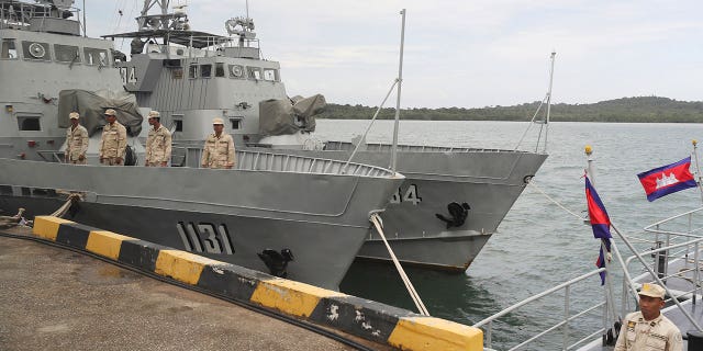 Cambodian navy crew stand on a patrol boat at the Ream Naval Base in Sihanoukville, southwest of Phnom Penh, Cambodia, July 26, 2019. Cambodian officials broke ground Wednesday, June 8, 2022, on a naval port expansion project in Ream, dismissing American concerns it could provide Beijing with a strategically important outpost on the Gulf of Thailand. (AP Photo/Heng Sinith, File)