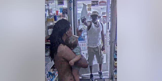 Detroit man holding baby reacts quickly to gas station gunman. 