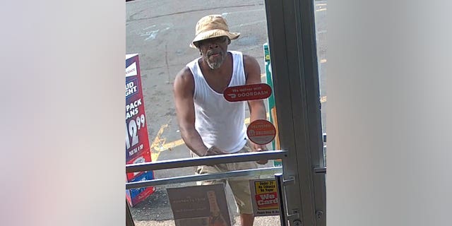 Detroit suspect in bucket hat and A-shirt seen at gas station before drawing a gun on a baby inside holding a 7-month-old baby.