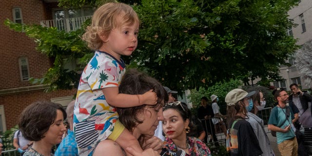 A child sits on his guardian's shoulders during a New York City protest after a Supreme Court decision overturned Roe V. Wade. (Credit: John Mantel for Fox News Digital)