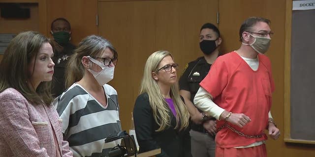 Jennifer and James Crumbley, the parents of suspect Oxford High School shooter Ethan Crumbley, appear in court on Monday. 