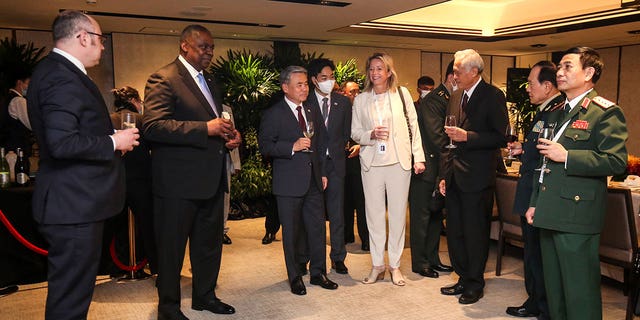 U.S. Secretary of Defense Lloyd Austin, second fro left, and other defense ministers gather during the 19th International Institute for Strategic Studies (IISS) Shangri-la Dialogue, Asia's premier defense forum, in Singapore, Saturday, June 11, 2022. 