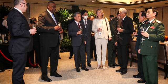 U.S. Secretary of Defense Lloyd Austin, second fro left, and other defense ministers gather during the 19th International Institute for Strategic Studies (IISS) Shangri-la Dialogue, Asia's premier defense forum, in Singapore, Saturday, June 11, 2022. 