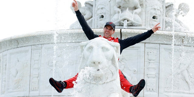 Power also climbed the fountain to celebrate winning the final race that will be held on Belle Island.