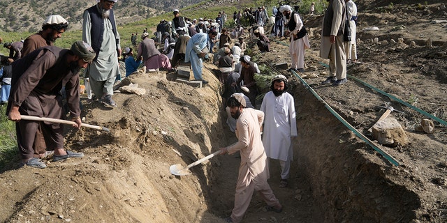 Afghans dig a trench for a mass grave for their relatives killed in an earthquake at a burial site in Gayan village, Paktika province, Afghanistan on Thursday, June 23, 2022. A powerful earthquake hit a rugged and mountainous region of 'Eastern Afghanistan early Wednesday, the flattening of stone and mud brick homes in the country's deadliest earthquake in two decades, the state news agency reported.