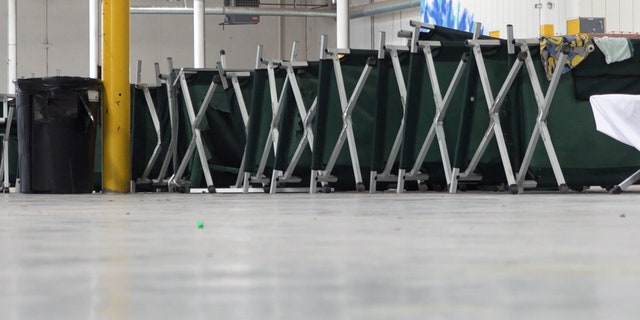Cots turned on their sides are cleaned and ready for new guests at this migrant shelter in El Paso, Texas.