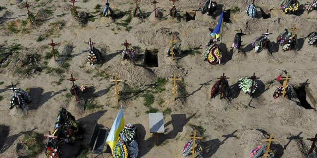 Tombs of people who died after Russia invasion are seen in Bucha cemetery, outskirts of Kyiv, Ukraine, Tuesday, May 24.