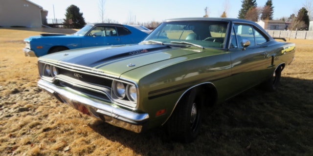A 1973 Dodge Dart Sport coupe and 1970 Plymouth GTX coupe are among Moser's collection.