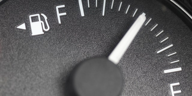 The symbol points to the side the fuel filler door is on.
