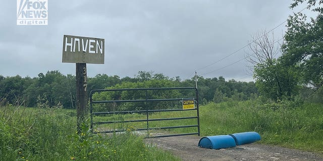 Visited on Thursday, the camp's front gate was closed, barrels were placed in the road and a "private property" sign was visible.