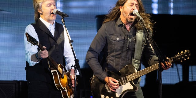 Paul McCartney and Dave Grohl perform at Glastonbury Festival in England Saturday night. The 53-year-old musician's last show was with Hawkins at Lollapalooza Chile March 20. Hawkins died in his hotel room in Bogotá, Colombia, March 25.