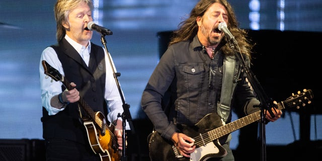Paul McCartney and Dave Grohl perform at Glastonbury Festival in England.