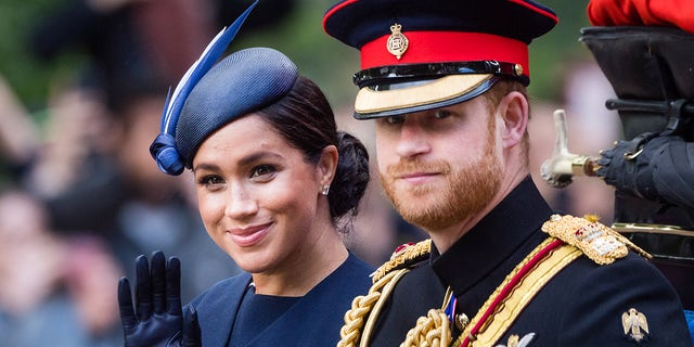 The Duke and Duchess of Sussex ride by carriage down the Mall during Trooping The Colour, the Queen's annual birthday parade, on June 08, 2019 in London, England.