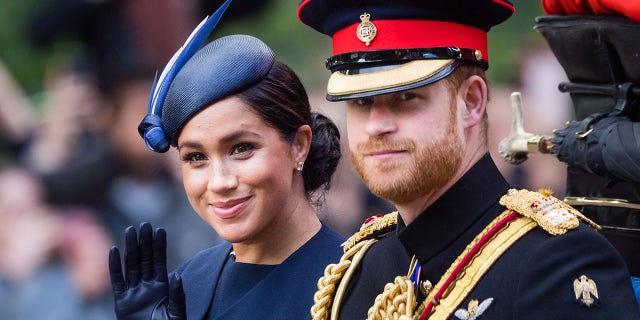 The Duke and Duchess of Sussex ride by carriage down the Mall during Trooping The Colour, the Queen's annual birthday parade, on June 08, 2019 in London, England.