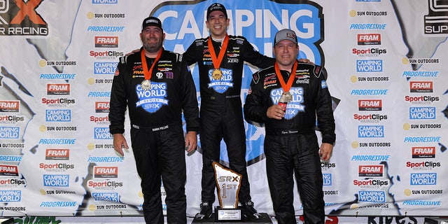 Bubba Pollard and Ryan Newman joined winner Helio Castroneves on the podium.