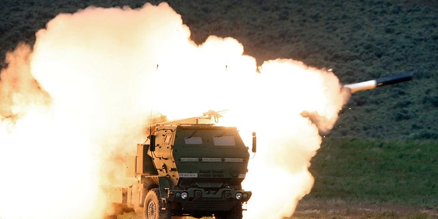On May 23, 2011, a launch truck launches the High Mobility Artillery Rocket System (HIMARS) manufactured by Lockheed Martin during combat training in the high desert of the Yakima Training Center in Washington, USA. 