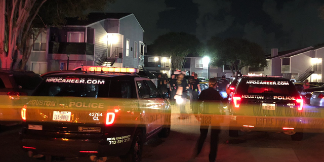 Photo of police officers responding to a shooting at an apartment complex in Harris County, Texas, on May 30. (Houston Police Department)