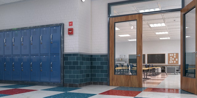 Image of an empty classroom from a hallway.
